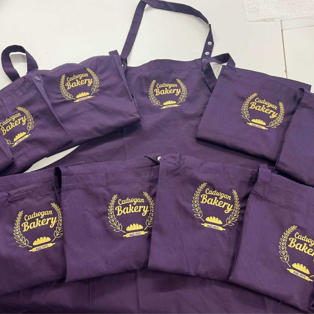 personalised branded chef jacket with logo print embroidered high quality cake bake international custom and aprons purple gold