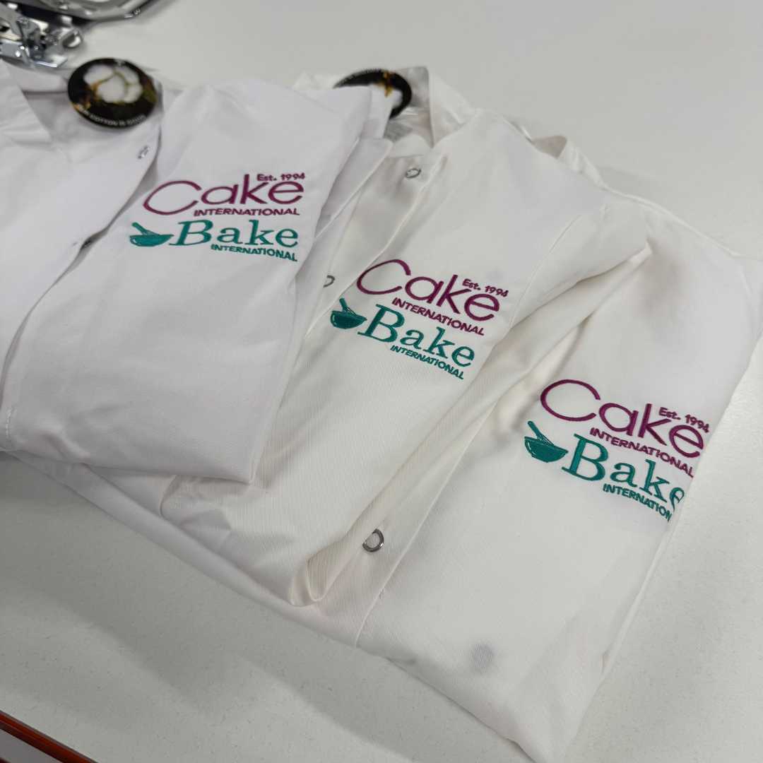 personalised branded chef jacket with logo print embroidered high quality cake bake international custom white purple